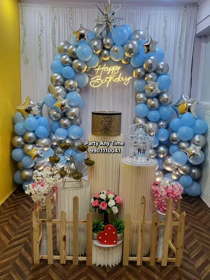 A blue and silver balloon arch setup in my party hall, showing a different color option for the same affordable package.