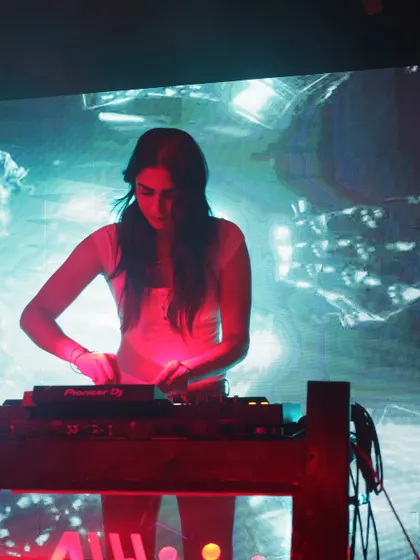 A focused shot of me working the decks at Ibiza, Jhansi. This captures the concentration and passion I pour into every single transition and track selection.