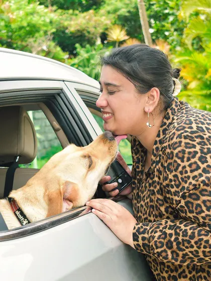 A celebratory kiss right through the car window! These candid moments of love and affection are what make Gotcha Day and adoption anniversary shoots so incredibly special.