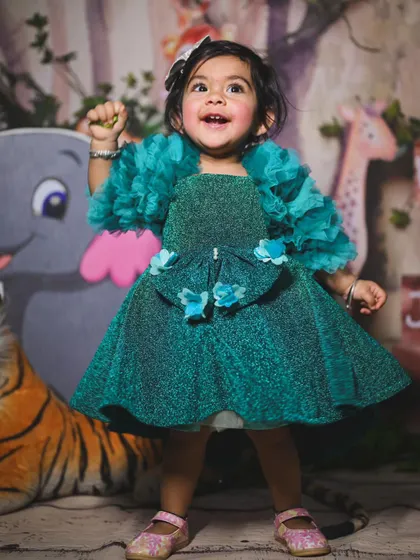 A beautiful, sparkly dress for a special occasion. This portrait from a jungle-themed shoot shows how a change of outfit can create a completely different, more formal look.