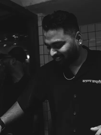 A candid black and white shot of me smiling during a set. This is my passion, and it shows.