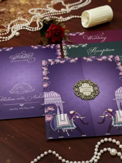 I designed this invitation suite to evoke a sense of royal celebration. The deep purple card features majestic elephant illustrations and traditional dome motifs, complemented by a custom laser-cut monogram. The set includes separate inserts for the wedding and reception.