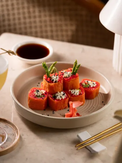 Asparagus and cream cheese sushi rolls. The unique presentation with asparagus spears makes this dish visually interesting.