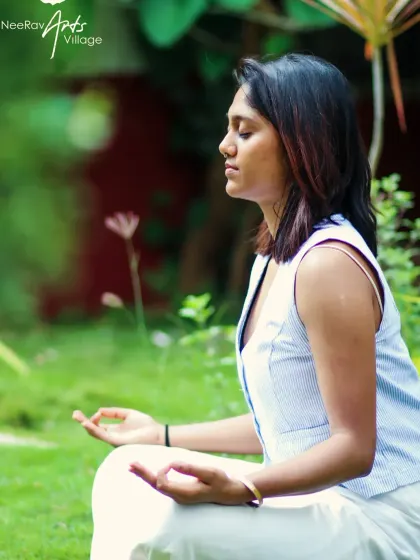 Finding stillness in a simple seated meditation pose, focusing on the breath. This is the foundation of a mindful yoga practice.