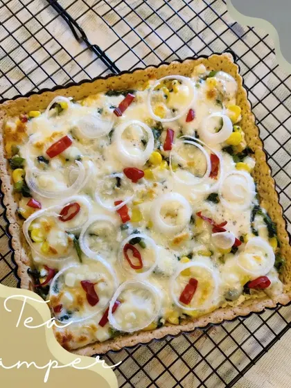 Our Corn Spinach Quiche is a popular item in our tea-time hampers, pairing perfectly with other savoury baked goods like cheese straws and focaccia.
