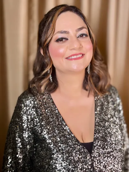 A happy and confident client, ready for her party.