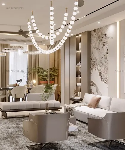 An expansive view of the beige and wood living room, showing the open-plan layout that connects the lounge and dining areas. The large rug helps to ground the seating arrangement.