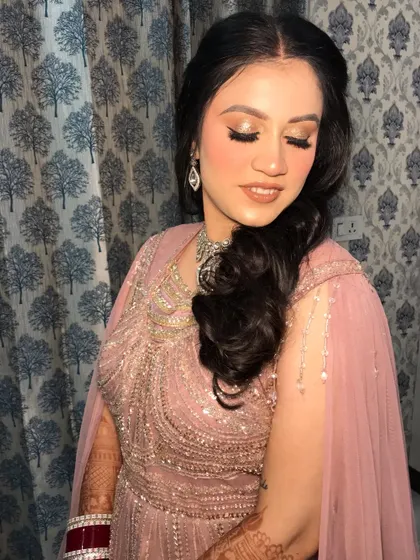 An eyes-closed shot of the reception bride, highlighting the beautiful shimmer on her eyelids.