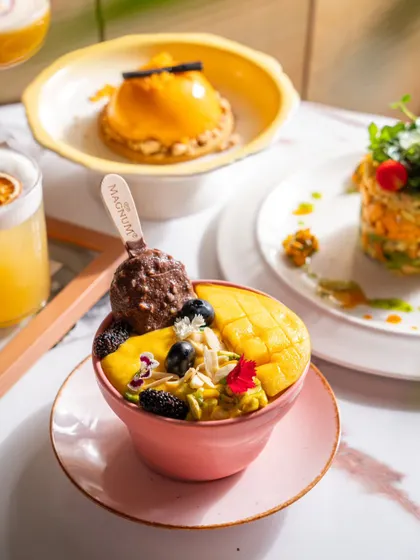 A colourful smoothie bowl from Blah Bombay, topped with a Magnum ice cream. This shot highlights a unique and indulgent menu item that is sure to grab attention.