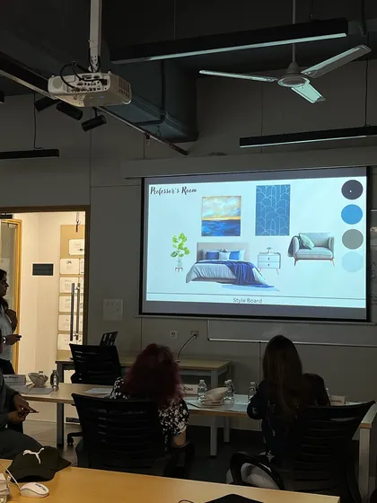 Our co-founder, Shilpi Dhingra, serving as a jury member for interior design students at the JS Institute of Design. Here she is reviewing a student's mood board and color palette presentation.