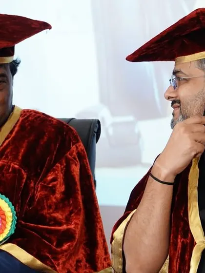 Sharing a moment of conversation with the Founder Chairman of SKIES, Dr. M. Rukmangadha Naidu, on the dais.