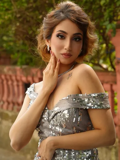 Another angle of the silver sequin dress look, showcasing the flawless makeup and hair. Our photoshoots are designed to build a powerful portfolio.