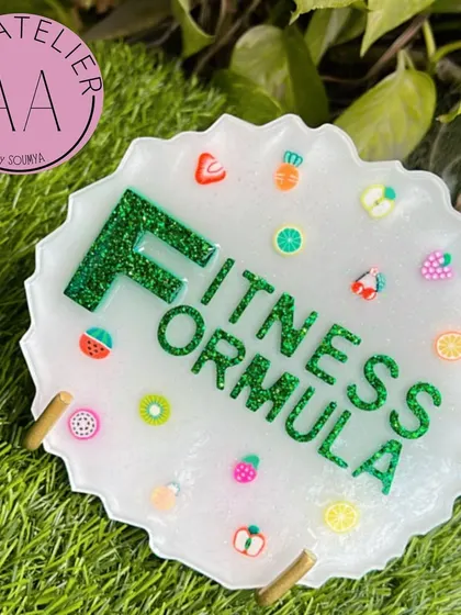 A custom resin tabletop sign I designed for a dietitian. The fun fruit charms and glittery green lettering perfectly match her brand, 'Fitness Formula'.