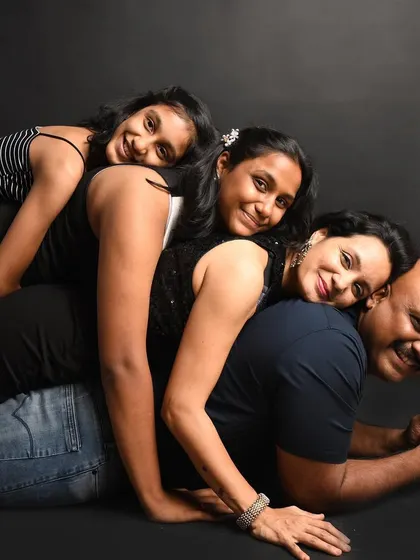 A fun and playful "family stack" pose. These sessions are all about creating happy memories and photos that show your family's unique spirit.