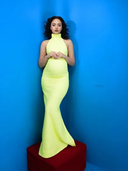 Wrapping up this maternity style series with a radiant look. Motherhood deserves every bit of sparkle, and this neon dress against a bold blue is pure fashion.