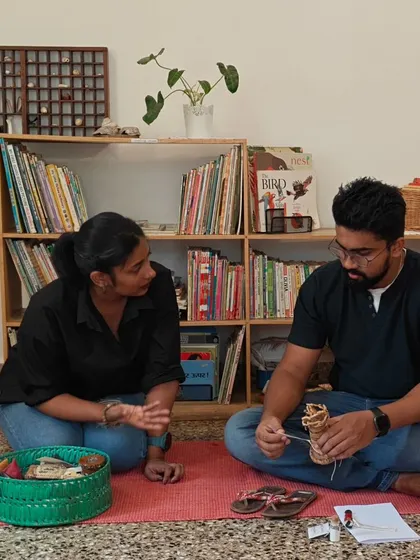 An AMI guide in conversation with a parent during a workshop. We are here to sit beside you, answer your questions, and share insights as you explore the Montessori method and your own parenting path.