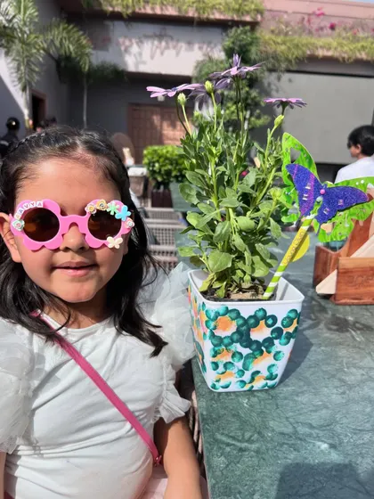 So much fun in one photo! This partygoer is rocking her custom-decorated sunglasses while posing with her painted planter. Our parties are all about creating and celebrating in style.