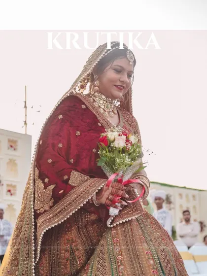 A picture-perfect moment of our stunning bride holding her bouquet as she walks down the aisle.