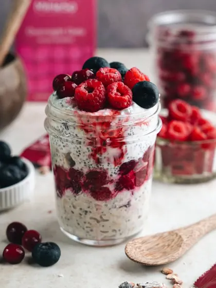 A healthy and beautiful breakfast-as-dessert shot of overnight oats with berries, styled and shot for Miheso.