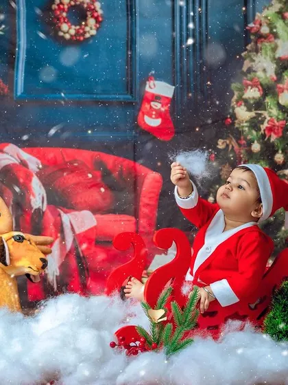 A moment of wonder, looking at the falling snow. These themed sessions are designed to be an experience for your child.