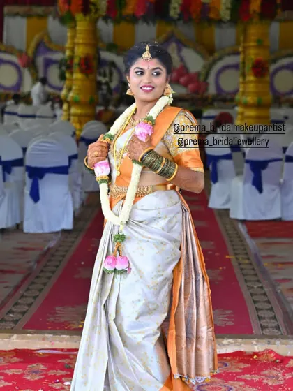 A full-length view showing the bride's entire look, including the vaddanam and bangles.