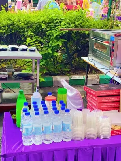 Our live pizza counter setup at the Carlton Estates community event. We come fully equipped with our oven, ingredients, water, and pizza boxes for a complete and hassle-free catering service.