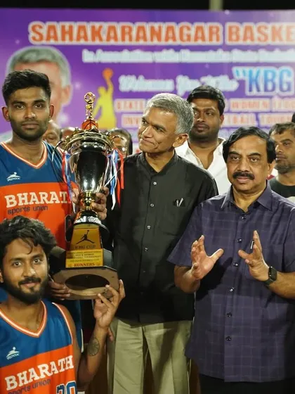 A close-up of the team with the trophy after a hard-fought tournament.