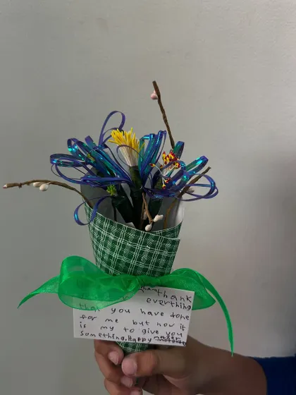 Each Mother's Day flower bouquet is unique, just like every mom. This one features a lovely green and blue color scheme and a sweet, handwritten message.