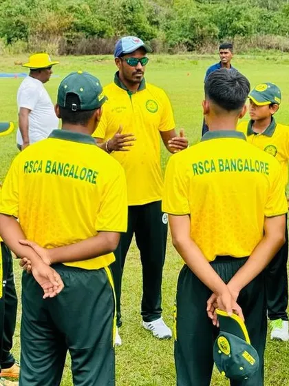 A coach provides instructions to the team during a training session in Sri Lanka.