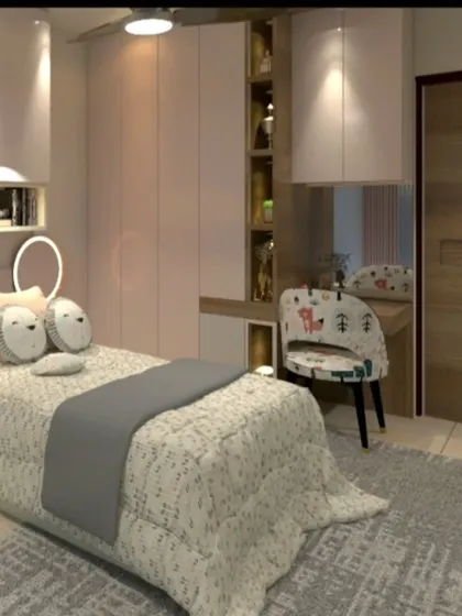 A close-up of the dressing table and wardrobe in the pink-themed room.