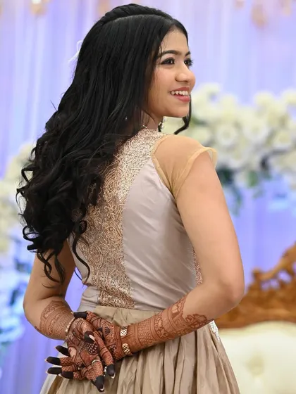 A beautiful shot of a guest showing the back of her hands, adorned with a rich henna stain.