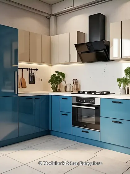 This L-shaped kitchen features bold, glossy blue cabinets paired with neutral upper cabinets. The layout is designed for efficiency, with the stove, oven, and sink in a classic work triangle.