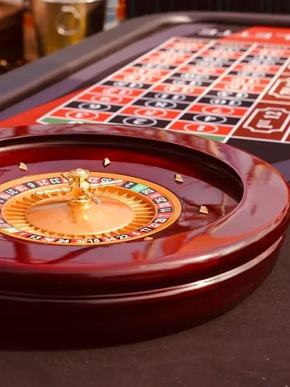 A close-up of a roulette wheel, part of the casino games setup. These interactive elements are a huge hit with guests and provide hours of entertainment.