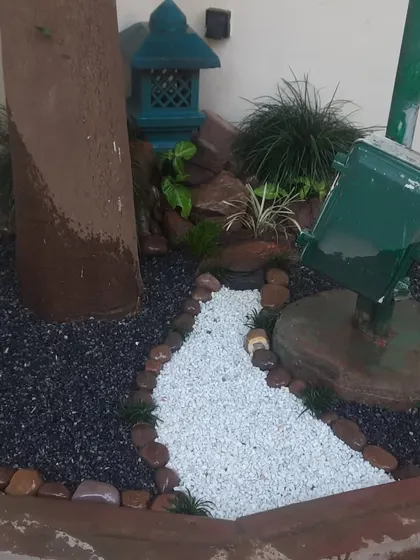 Another view of a custom stone garden I created. The design incorporates a miniature pagoda and a dry riverbed path, turning an unused corner into a point of interest.