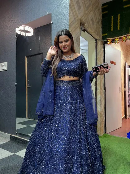 This navy blue sequin lehenga is a showstopper. It's perfect for a cocktail party or reception shoot where you want to create a glamorous, high-impact look.