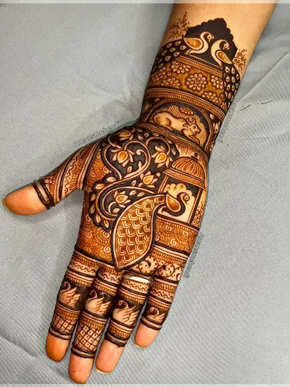 A very dense and intricate design featuring multiple peacocks, a lantern, and other traditional motifs. The use of negative space makes the figures pop.