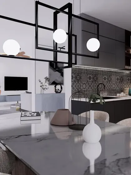 A minimalist dining area with a marble-top table and a striking geometric chandelier that acts as a functional sculpture.