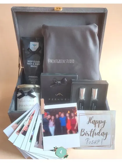We love adding personal touches like a fan of polaroid photos to this birthday hamper. It's a great way to include shared memories alongside grooming products, perfumes, and a scented candle.