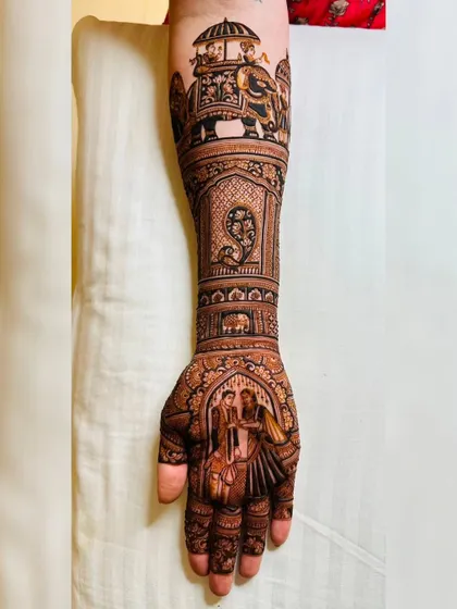 It was a pleasure creating this intricate bridal design for a client from abroad, incorporating traditional Indian wedding scenes, including a couple portrait and an elephant motif.