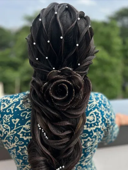 The 3D rose braid from another angle, showing the incredible detail and artistry involved. This is a true statement hairstyle.