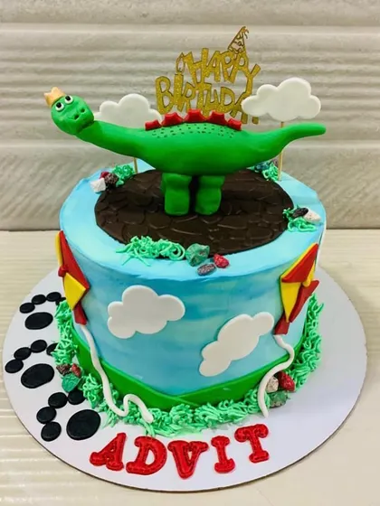 A still shot of the adorable dinosaur-themed birthday cake, perfect for a young dino fan's party.