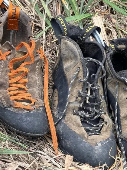 A close up of well loved climbing shoes. This image speaks to the dedication and passion of our community, and the many hours spent on the rock.
