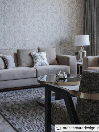 A closer look at the seating area in the 'Aria Residence'. The mix of textures in the upholstery and the geometric rug creates a layered and sophisticated look.