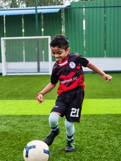With a smile on his face, this young player shows his growing confidence and control over the football.
