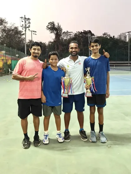 The players with their coaches after the U-14 doubles final.
