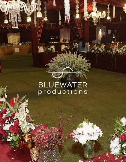 A closer view of the floral arrangements lining the long dining tables, adding a continuous line of beauty to the reception space.