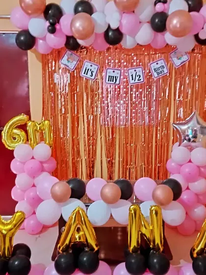 A closer view of the half-birthday setup, showing the "It's my 1/2 birthday" banner.