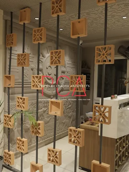 A detail shot of the terracotta block partition at the Jubinav Chadha studio, which acts as a screen while allowing light and views through.