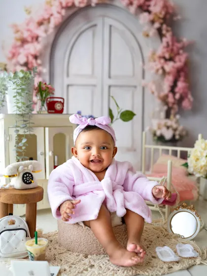 All smiles after her spa day. The tiny props like the mini Starbucks cup and laptop add such a fun, modern touch to this themed shoot.
