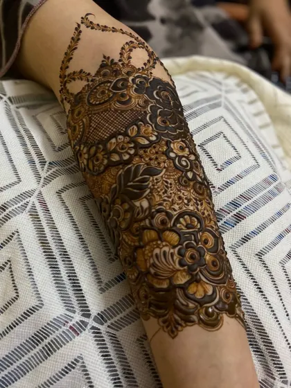 This is a detailed view of my intricate bridal henna work. Each design is unique, combining traditional patterns like paisleys and mandalas with fine-line fillers to create a stunning, full-coverage look for your special day.